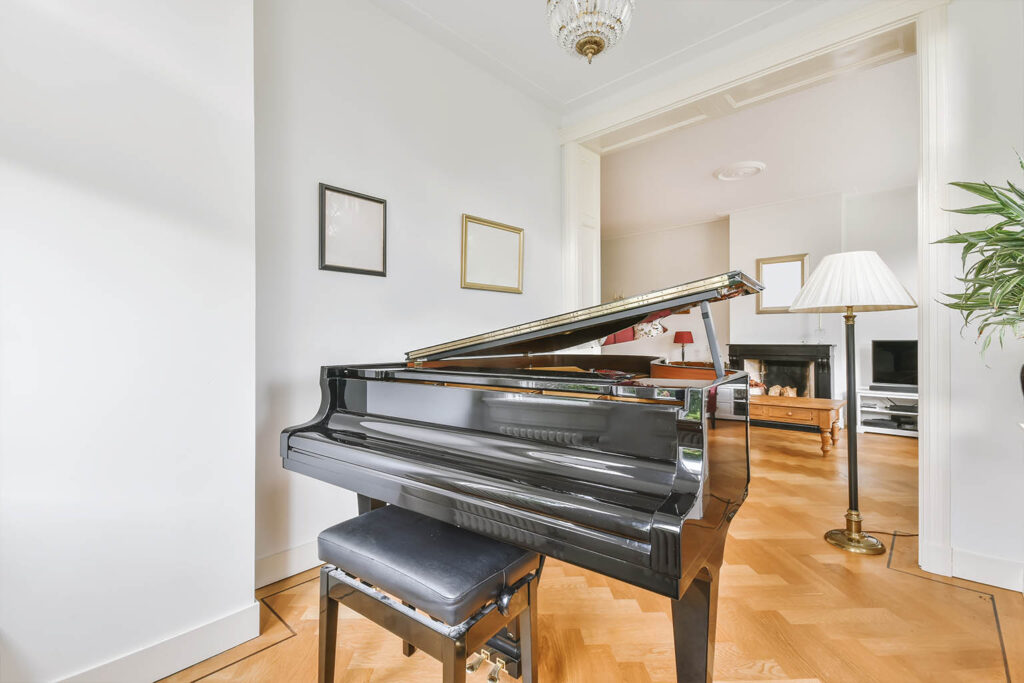 Upright piano prepared for a removal in Manchester